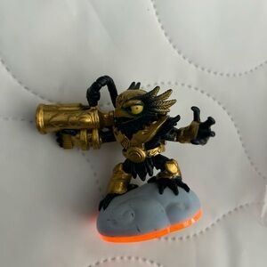 Golden and Black Action Figure with Orange Base
